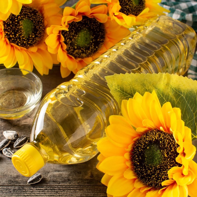 Sunflower oil plastic bottle on wooden table